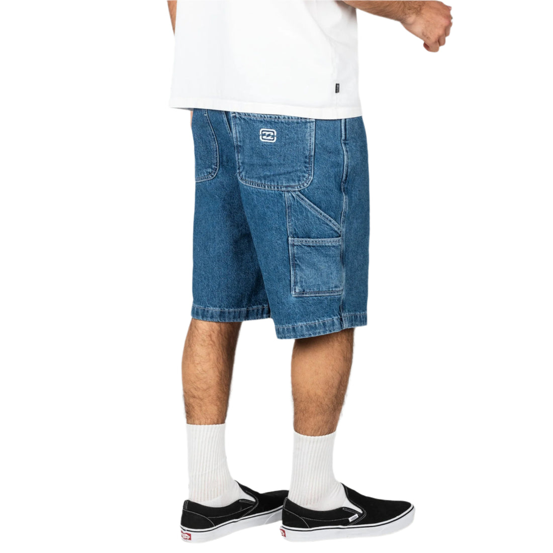 Billabong Bad Dog Workwear Short in Ocean Wash denim with relaxed fit, utility pockets, contrast stitching and 21" outseam.