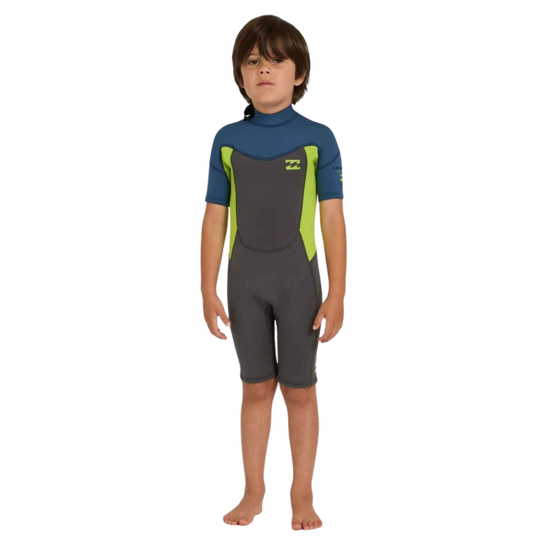 A child wearing a short-sleeve full-body wetsuit with a dark gray body, blue shoulders and neck, and bright lime green side panels, standing against a plain white background.