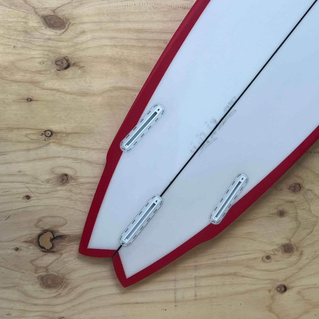 Christenson Lane Splitter surfboard with a swallow tail design red rail spray. 2+1 Futures Set up. Shop Christenson Surfboards at Freeride Surf & Skate NZ