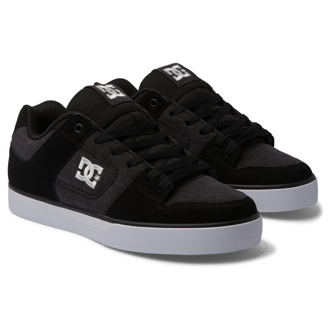DC Pure men's skate shoes in Black White Battleship with heavy-duty leather upper, padded silhouette and durable rubber cupsole.
