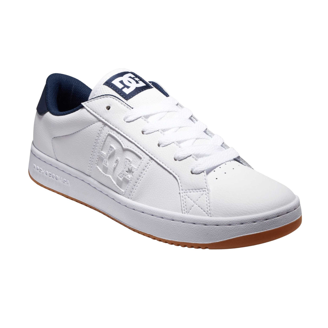 DC Striker men's shoes in White Navy with white leather upper, perforated forefoot and navy DC branding.