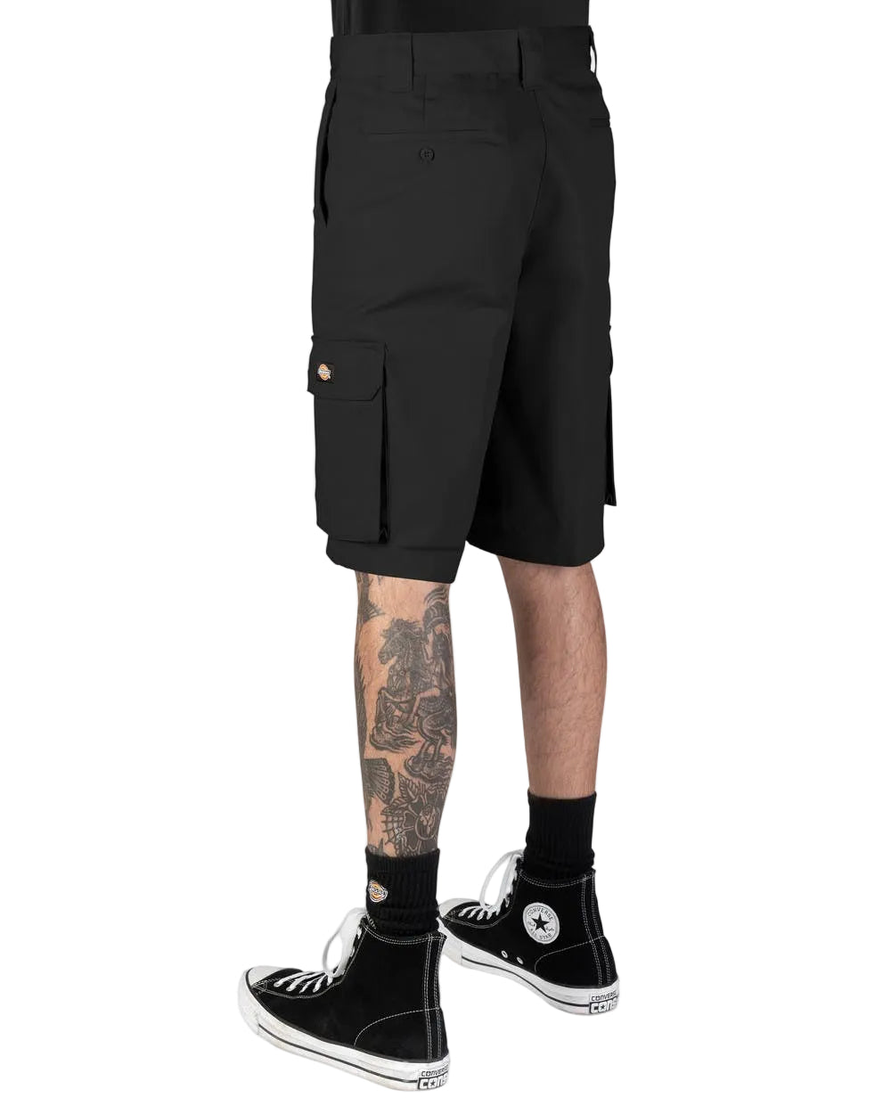 Black cargo shorts worn by a model, shown from the waist down, paired with black socks and black high-top sneakers on a white background.