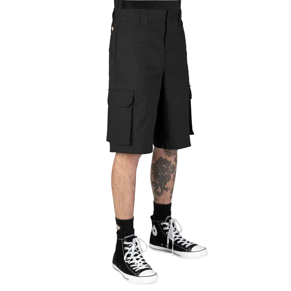 Black cargo shorts worn by a model, shown from the waist down with black socks and black high-top sneakers on a white background.
