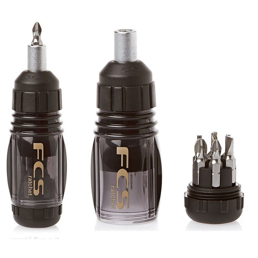 A set of FCS II ratchet tool with multiple hex bits attached, primarily black in color with silver accents. FCS II Ratchet Tool for fin installation at surf shop Auckland NZ