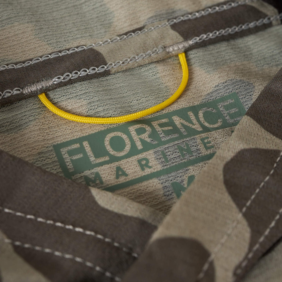 Close-up of Florence Airtex Long Sleeve Hooded Shirt Tundra Camo mesh fabric with UPF 50+ rating, NZ.
