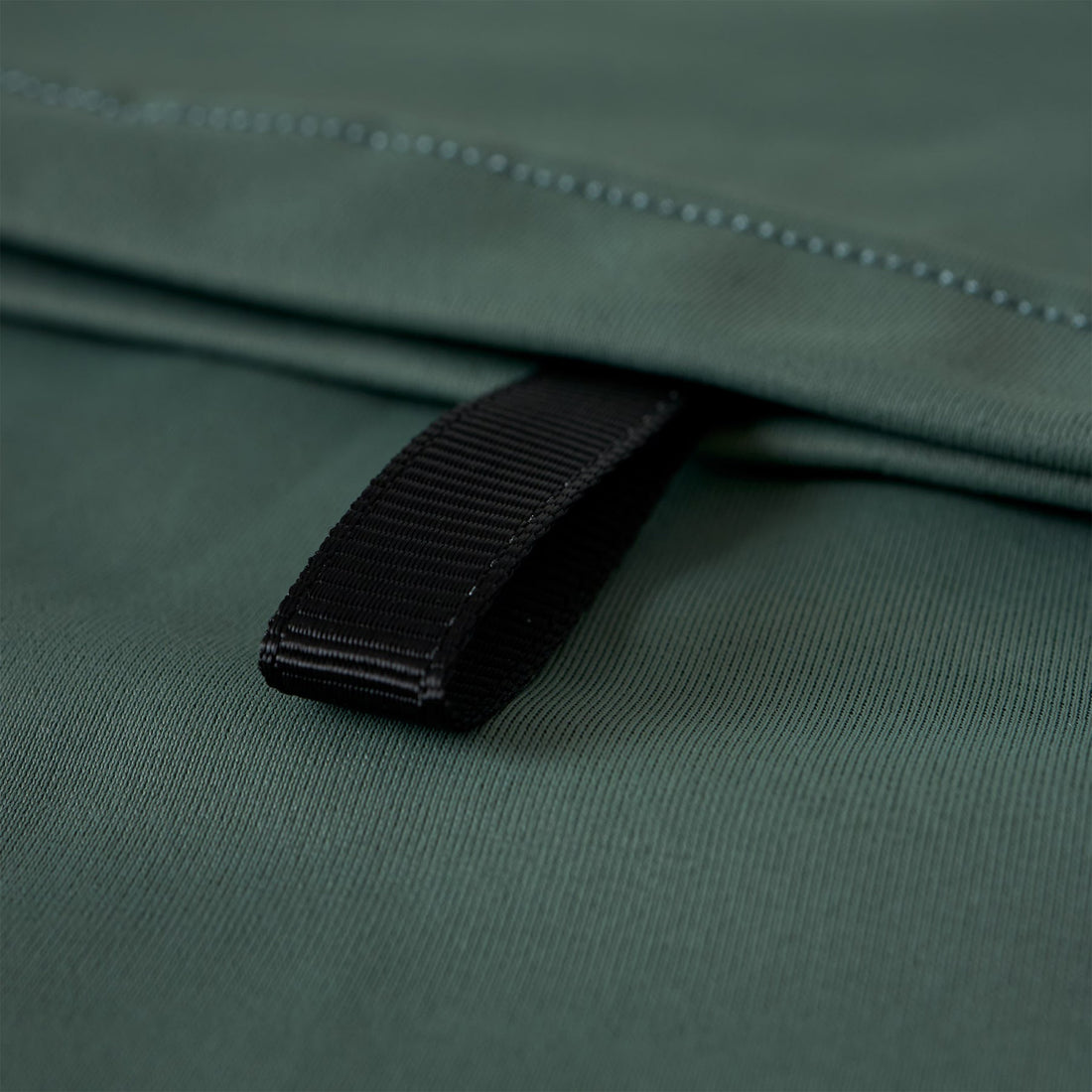 Florence Marine X utility pocket hooded rash guard in dark sage with UPF 50+ sun protection and rear zip pocket, available at Freeride Surf & Skate NZ.