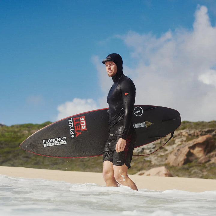 John John Florence wearing the standard issue Hooded rash guard in tropical conditions