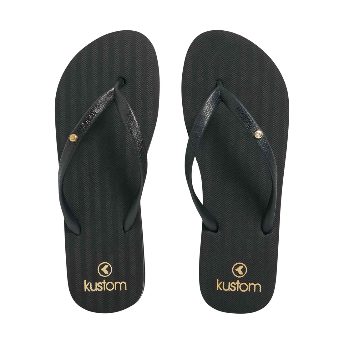 Kustom Infinity Black Thongs available at Freeride Surf & Skate NZ. A pair of black Kustom flip-flops with textured straps and gold logo branding, displayed side-by-side on a white background.