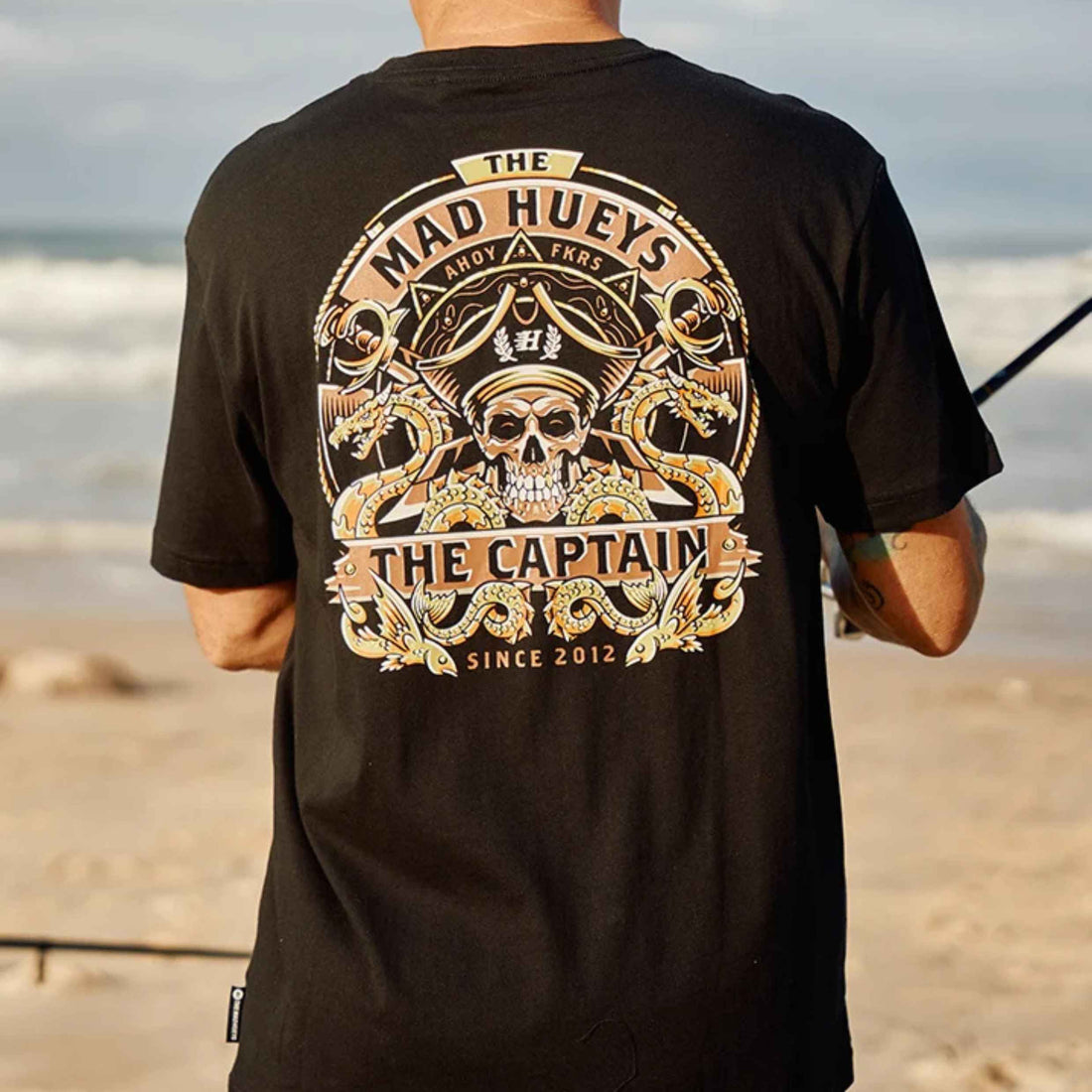 Mad Hueys Dragon Captain men's tee in Black with front chest and back graphic.
