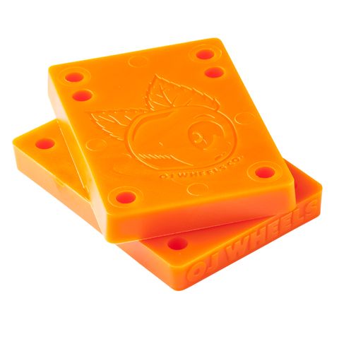 OJ Juice Cubes 3/8 Inch Orange Riser Pads — durable urethane skateboard risers for shock absorption and wheel bite prevention, available at Freeride Surf & Skate NZ