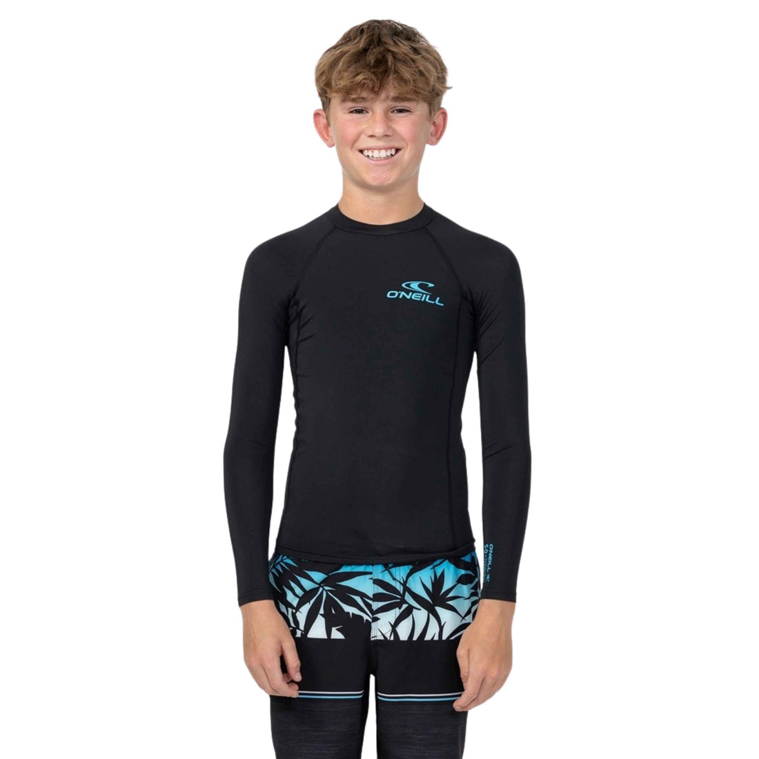 O'Neill Youth Clean & Mean Long Sleeve UV Rash Vest in Black featuring UPF 50+ sun protection, a tight fit and flatlock seams, available at Freeride Surf & Skate NZ.