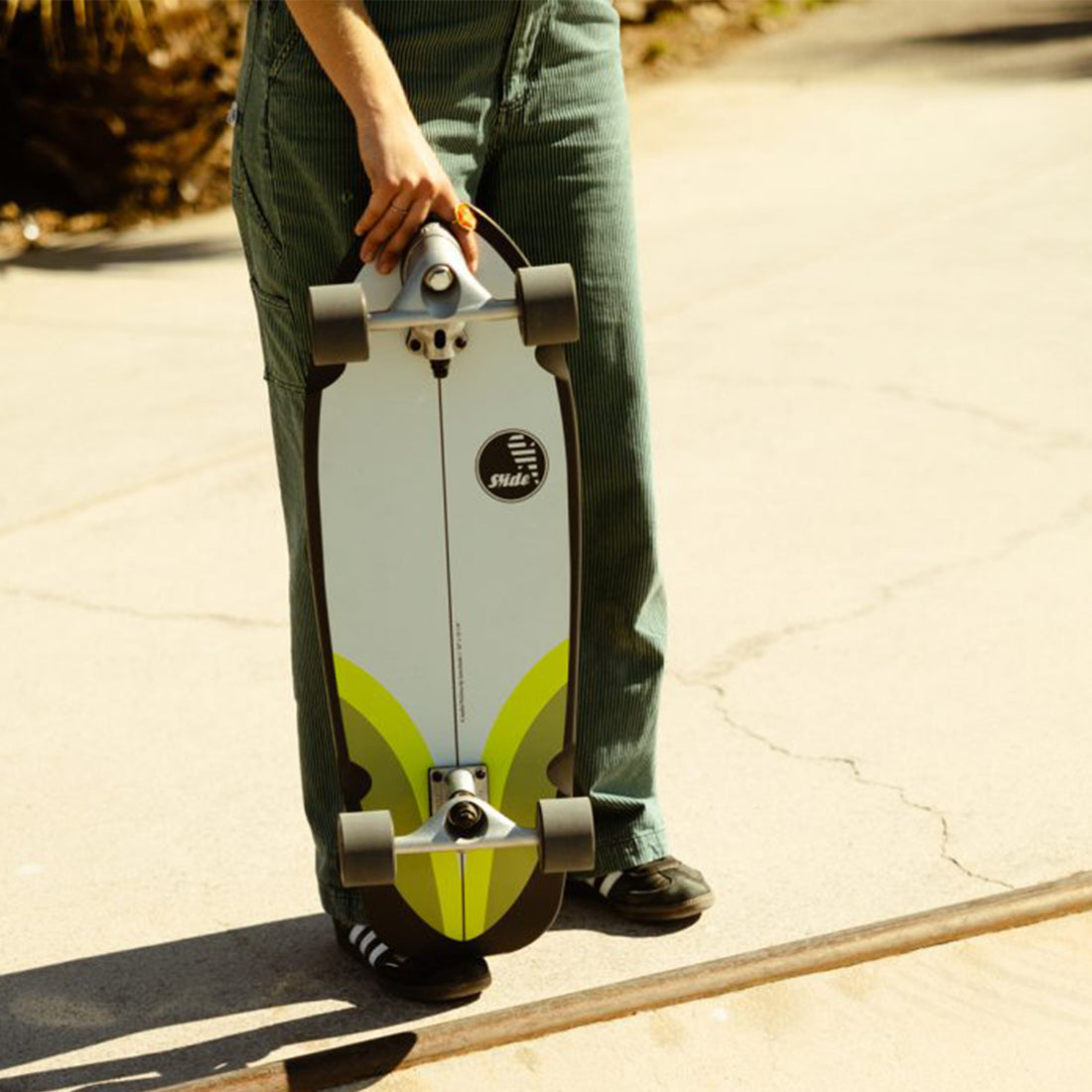 Slide Joyful Pinlime 30 Inch Surf Skate designed for carving and surf training.