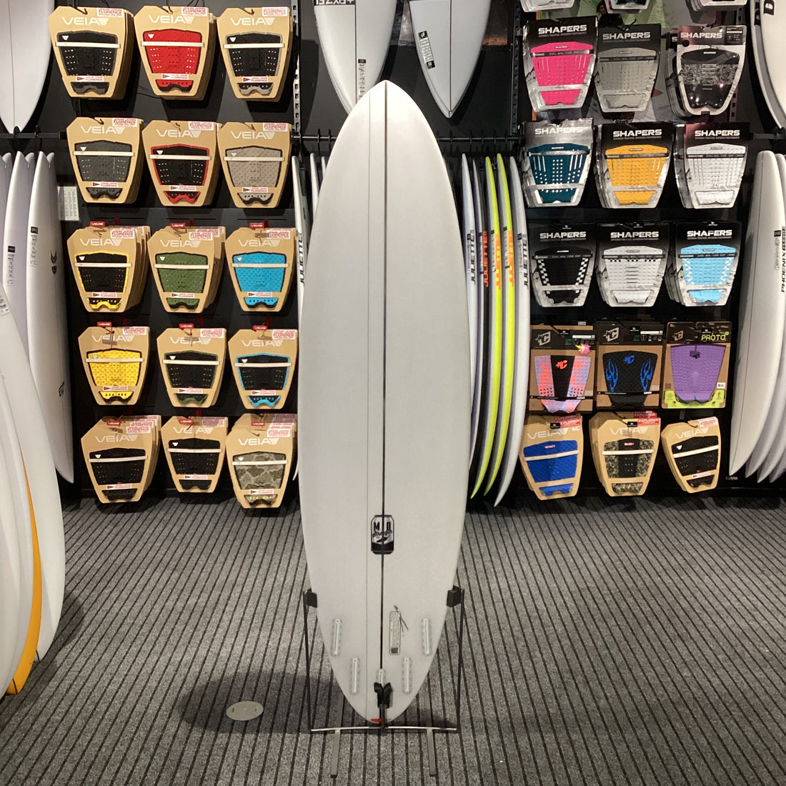Near-new Chilli Mid Strength surfboard 7'0 with Futures fin setup and 45.5L volume available at Freeride Surf & Skate NZ.