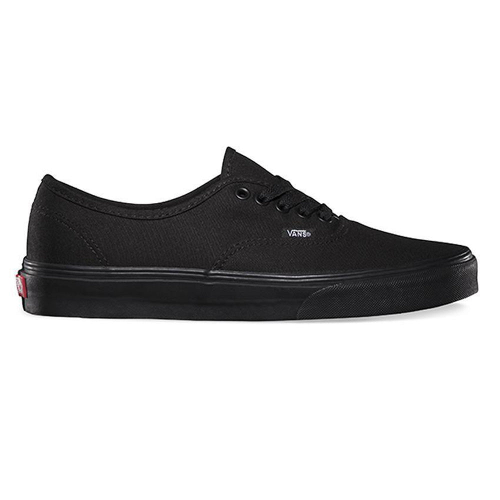 A pair of Vans Skate Authentic black sneakers with lace-up closure, displaying the iconic Vans logo on the tongue.
