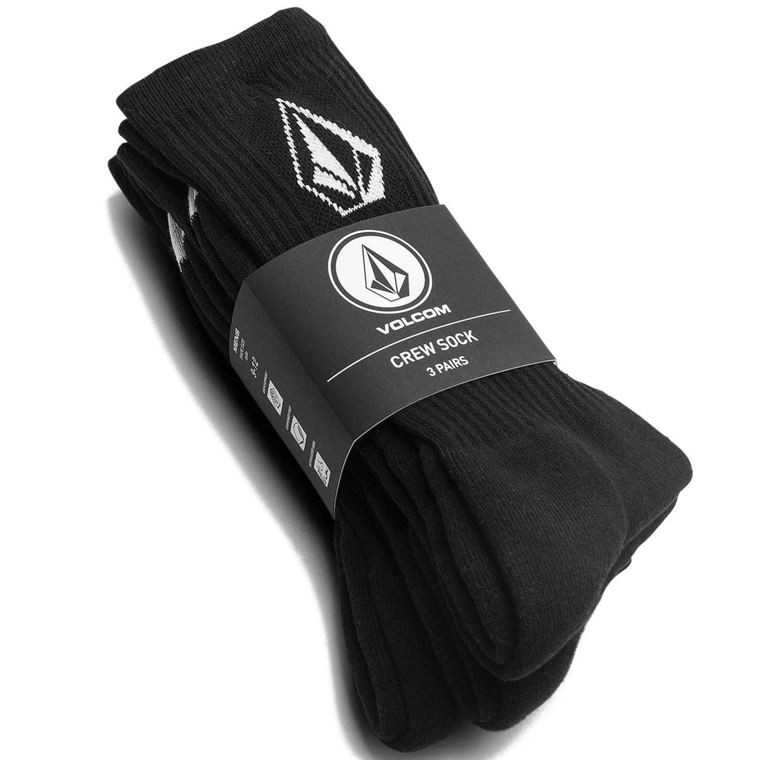 A pack of three black Volcom crew socks folded and wrapped in a black paper band with the Volcom logo, on a white background.