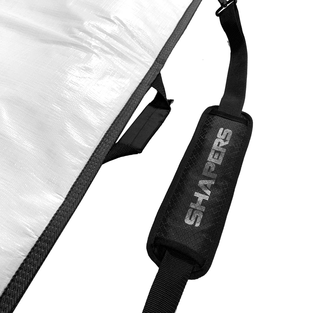 Shapers DayLite Longboard Cover 9’6" — padded lightweight longboard cover with fin slot, shoulder strap, and internal storage pocket, available at Freeride Surf & Skate NZ.