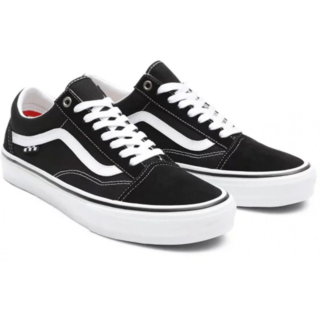 A pair of Vans Skate Pro Old Skool black and white sneakers with lace-up closure and a checkerboard flag on the side.